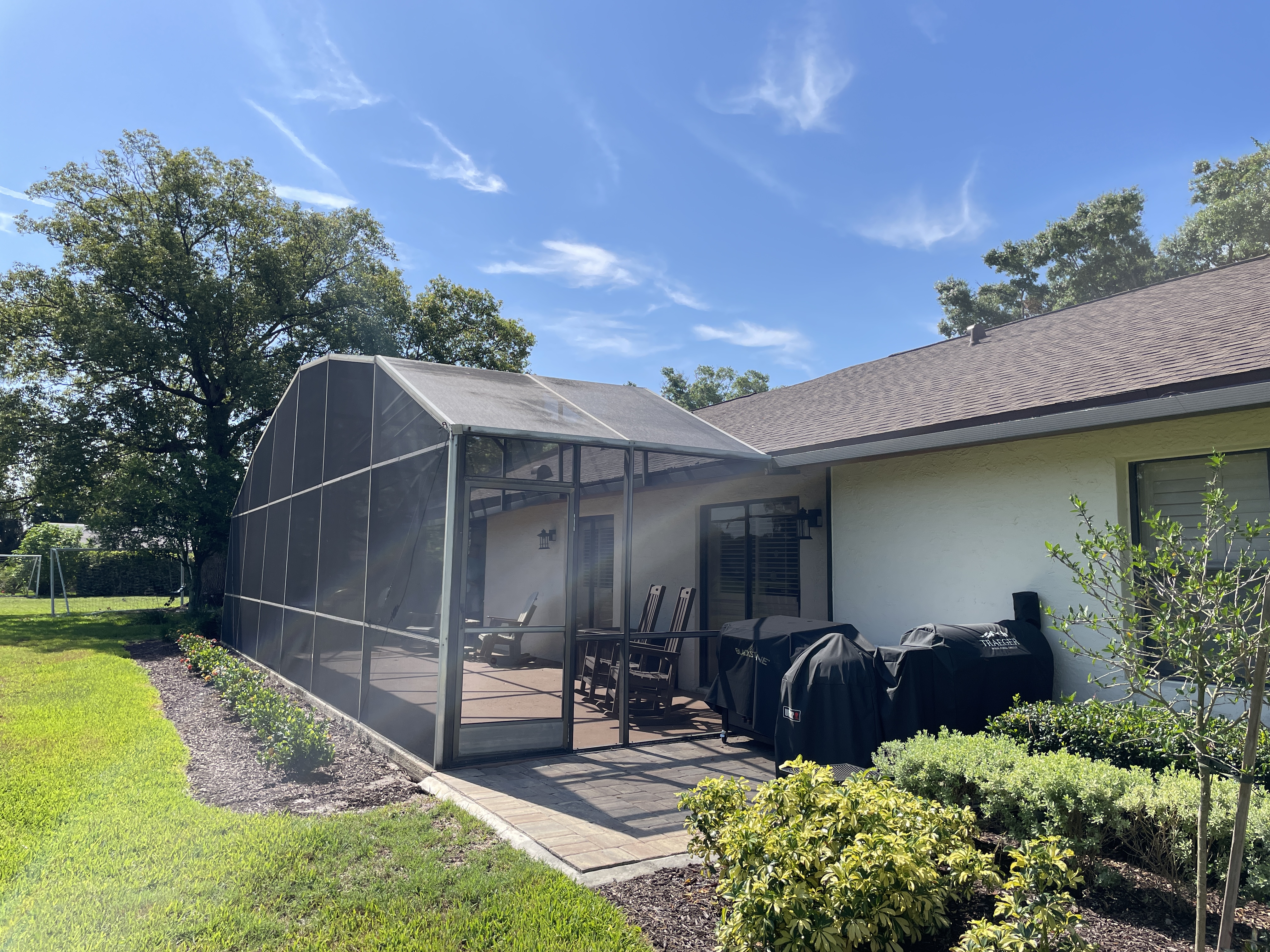 Damaged pool screen enclosure before repair