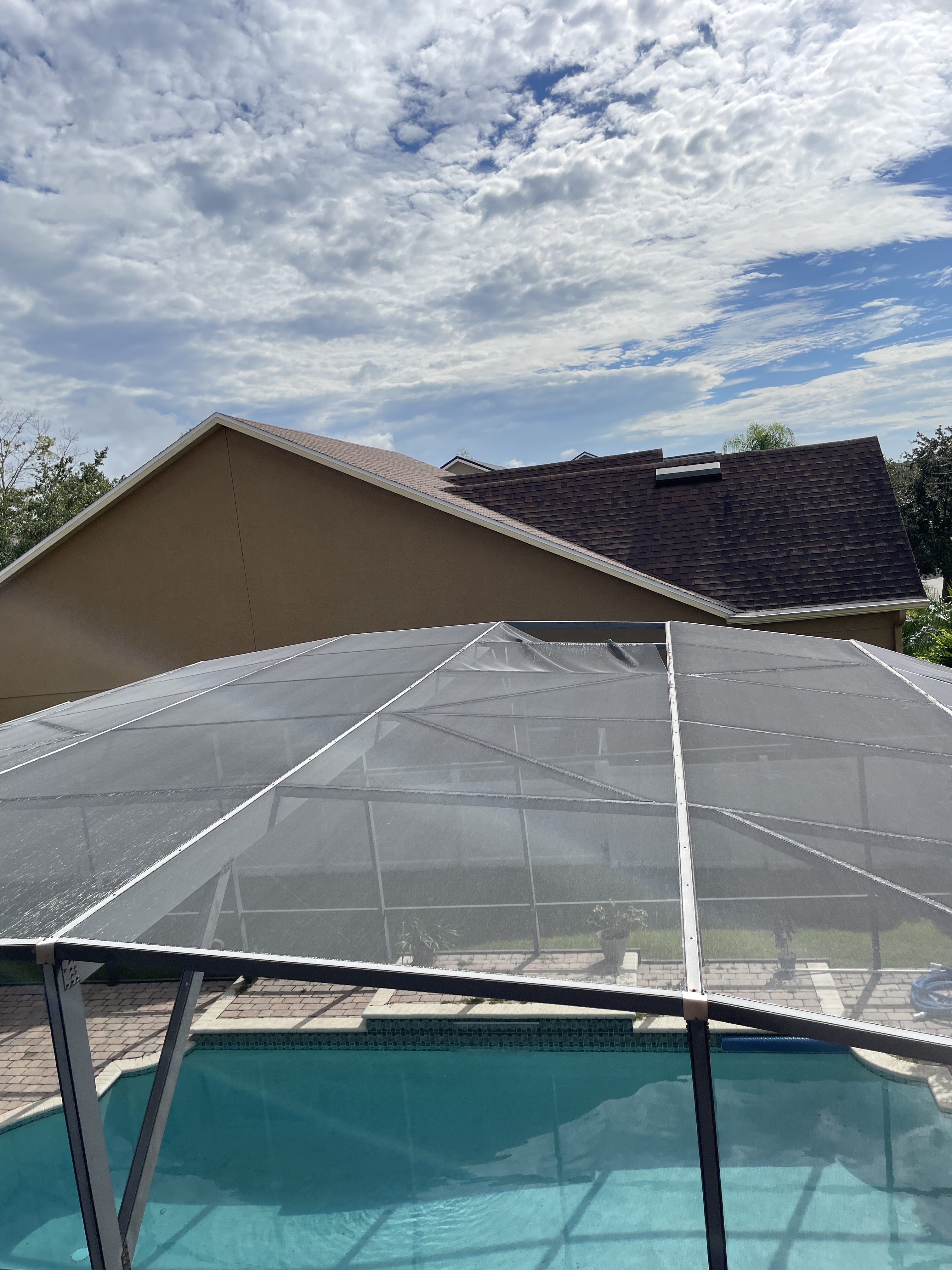 Damaged patio screen before repair